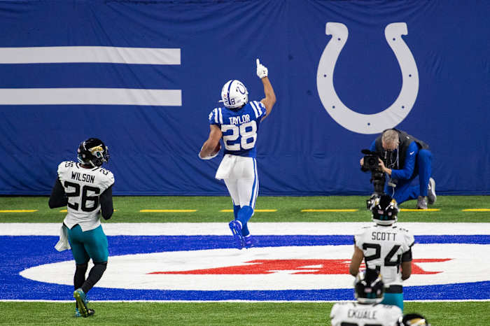 Indianapolis Colts running back Jonathan Taylor points skyward after scoring a touchdown in a Week 17 home win over the Jacksonville Jaguars at Lucas Oil Stadium.